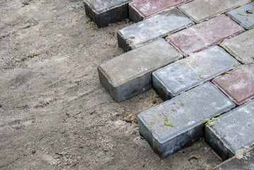 Installing paver bricks for the sidewalk pavement
