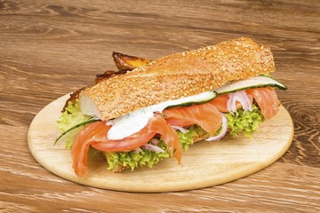 Sandwich on a wooden table. Stock image macro.
