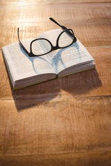 Close up view of a book and glasses