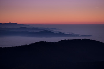 sunset over fog in Black Forest, Germany