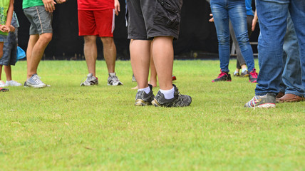 Fototapeta premium Legs on a grass field