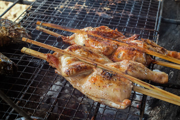 Roasting chicken on grill barbecue, thai style local food