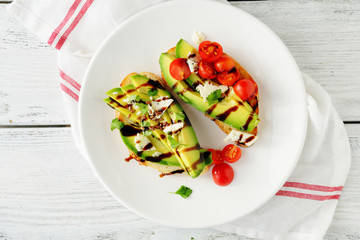 toasts with avocado and tomatoes