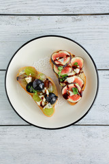 bruschetta with fruits and cheese