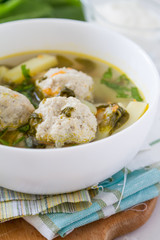 Sorrel soup in white bowl