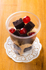 Creamy dessert in plastic cup