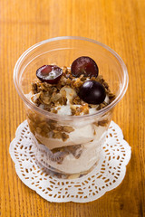 Creamy dessert in plastic cup