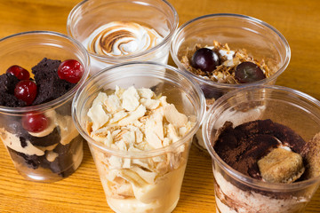 Creamy dessert in plastic cup