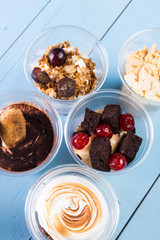 Creamy dessert in plastic cup