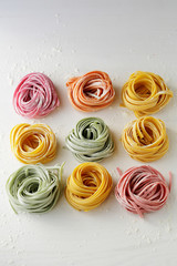 raw italian pasta on boards