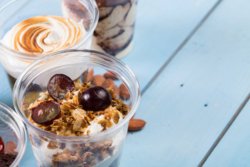 Creamy dessert in plastic cup