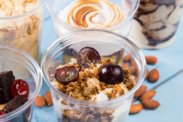 Creamy dessert in plastic cup