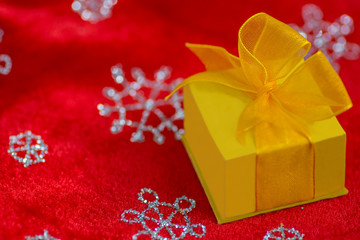 Yellow Christmas gift box with a bow