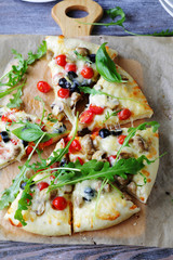 cheese pizza with mushrooms and cherry tomatoes