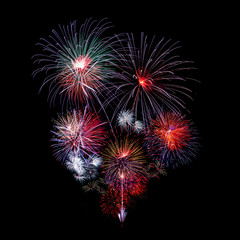 Colorful fireworks lighting up the night sky display for celebrations
