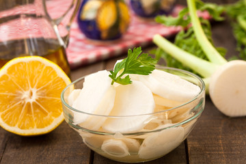     Daikon radish salad on rustic wooden table