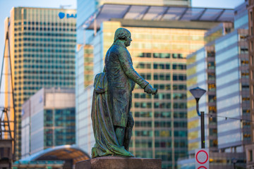 LONDON, UK - SEPTEMBER 9, 2015: Canary Wharf office buildings at sunset