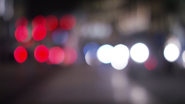 4K Blurred background lights of moving traffic at night in the city