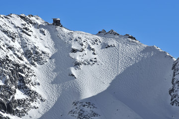 Skiing. Very steep glacier off piste run with moguls