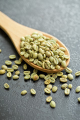 green coffee beans in spoon