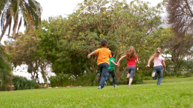 Happy children running at the park