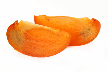 Two slices of persimmon isolated on white background