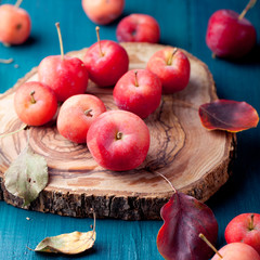 Red apples and leaves Wooden blue, turquoise background
