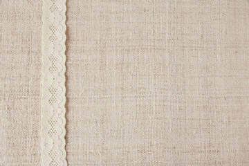 Lace on linen copy space background, vintage tone
