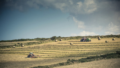 Tractors in a farmers field, cornwall