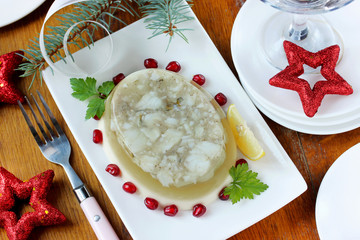 Appetizer of jellied fish on a festive table, selective focus