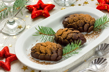 The original Christmas dessert of chocolate on a white background, selective focus