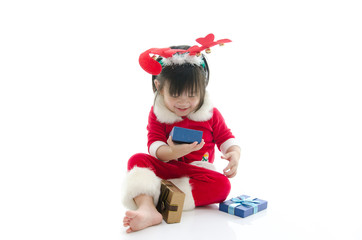 boy wearing Santa Claus uniform