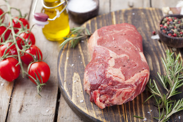 Grilled sliced barbecue pork ribs with cabbage salad cole slaw in a plate on a wooden background 
