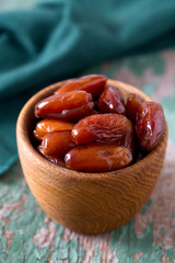 dried dates on a beautiful wooden background