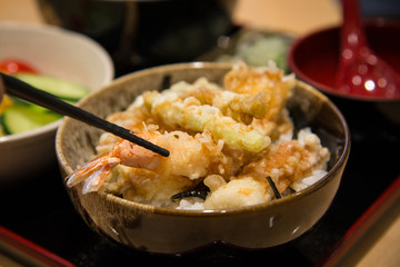 tempura served over a bowl of rice