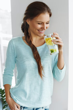 Healthy Food. Woman Drinking Lemon Detox Water. Healthy Eating.