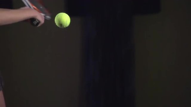 Tennis shots: Slice (slow motion, macro). Attractive girl playing tennis. Professional tennis player