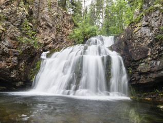 Fototapeta na wymiar Wild waterfall Myantyukoski, three steps stone cascade in Paanaj?rvi National Park