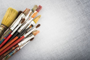 Fototapeta premium Artistic brushes on Canvas