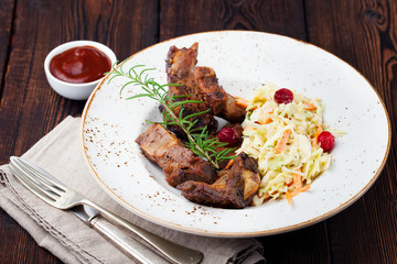 Grilled sliced barbecue pork ribs Salad cole slaw 