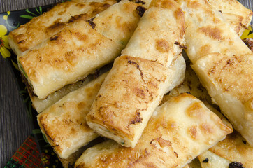 Fried rolls of pita with cheese