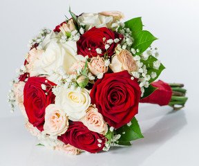 red bridal bouquet isolated on white background (shallow DOF)