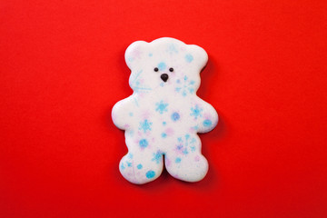 Christmas gingerbread cookies on red background.