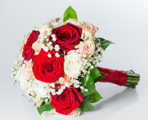 red bridal bouquet isolated on white background (shallow DOF)