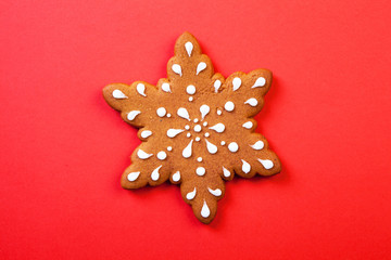Christmas gingerbread cookies on red background.