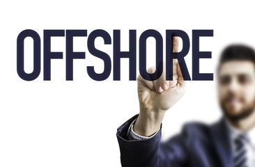 Business man pointing the text: Offshore