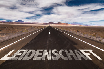 Passion (in German) written on desert road