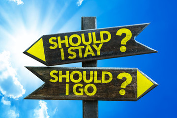 Should I Stay? Should I Go? signpost with sky background - obrazy, fototapety, plakaty