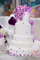 White wedding cake decorated with sugar bubbles