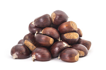 Pile, heap, of fresh organic chestnuts isolated on white background